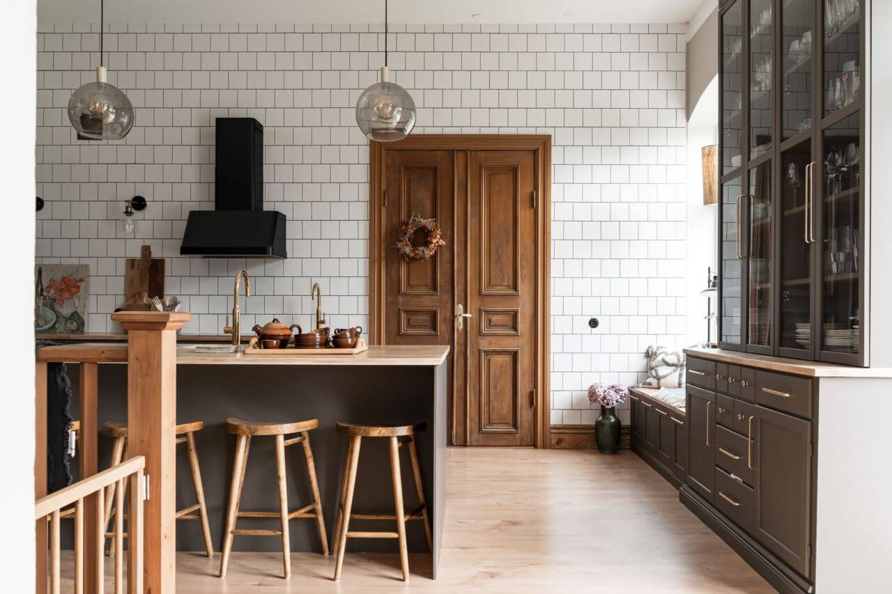 A Former Swedish School is Now a Beautiful Home 1 gray-kitchen-wooden-double-doors-floor-to-ceiling-tiled-wall-nordroom