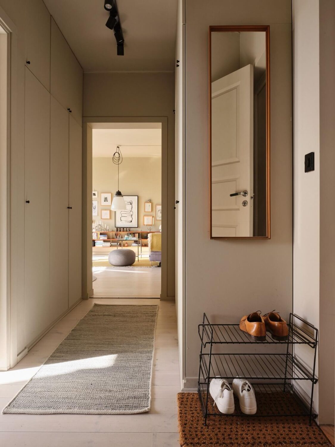 A Serene Beige Apartment with Two Balconies 18 hallway-built-in-closets-nordroom