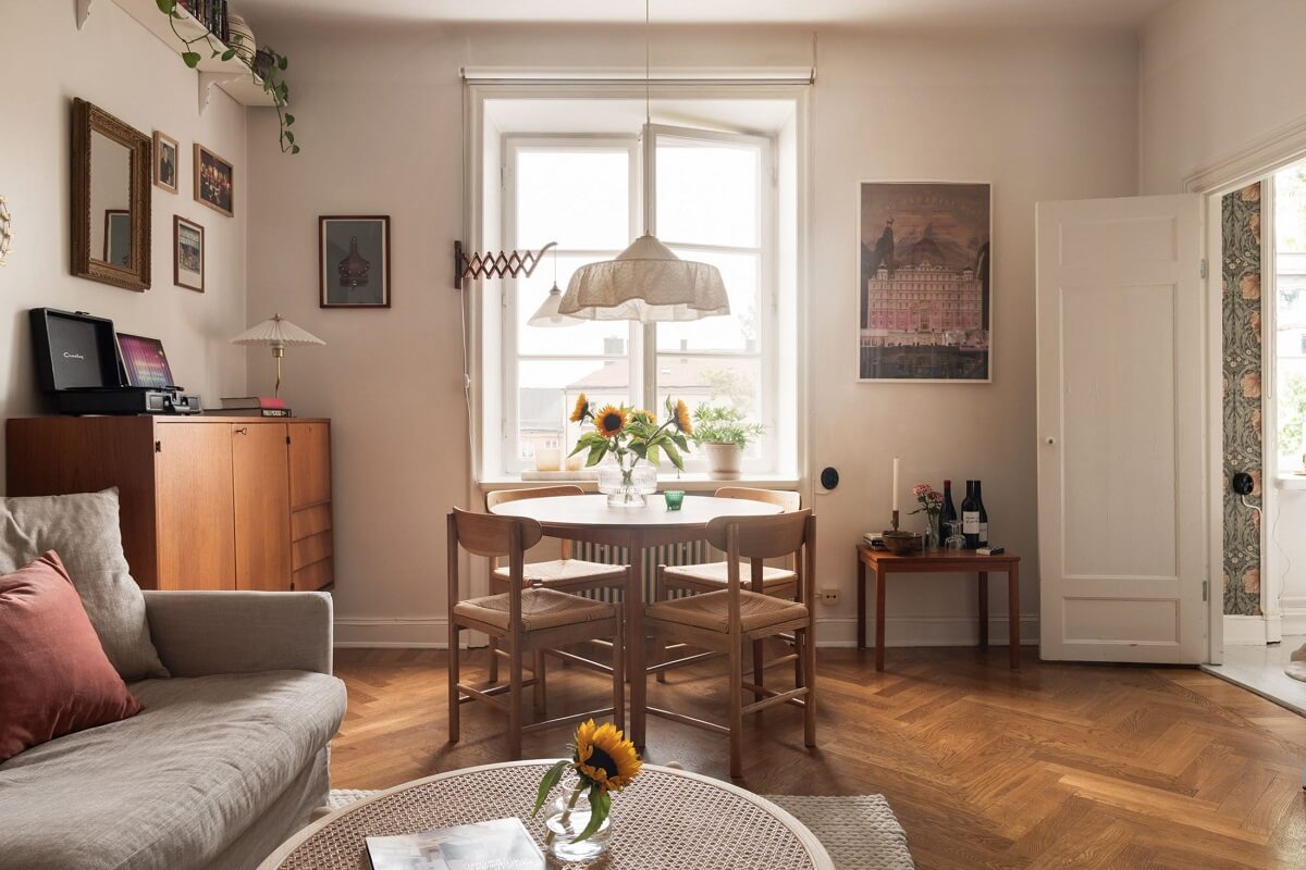 A Lovely Swedish Apartment with William Morris Bedroom 2 living-room-round-dining-table-wooden-floor-norroom