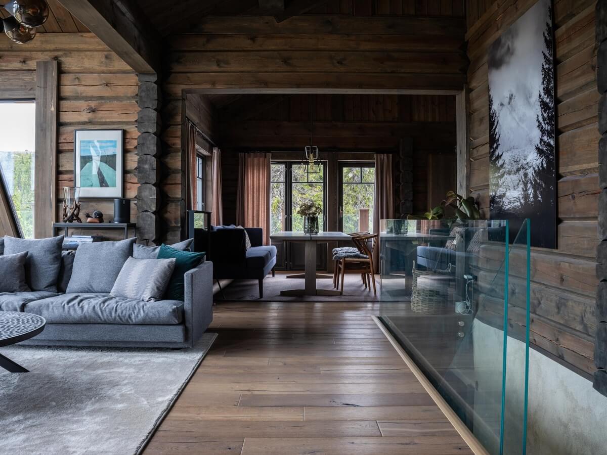 A Modern Rustic Log House in Sweden 1 log-house-open-plan-living-room-wooden-walls-nordroom