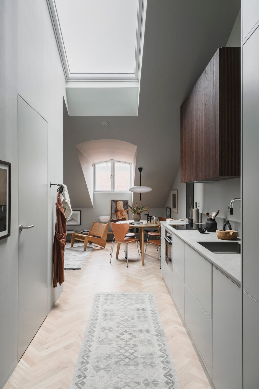 A Stylish Modern Gray Attic Apartment 11 gray-attic-apartment-modern-kitchen-skylight-nordroom