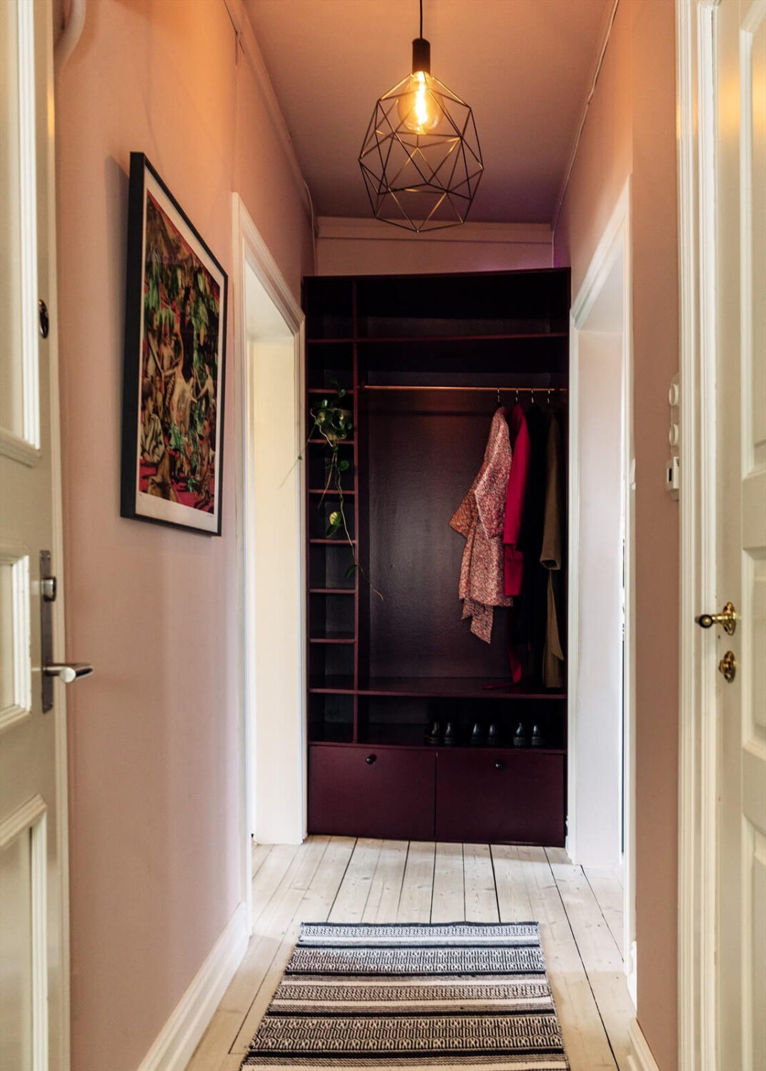 A Charming Norwegian Apartment with Wooden Walls 23 hallway-built-in-burgundy-coat-hanger-nordroom