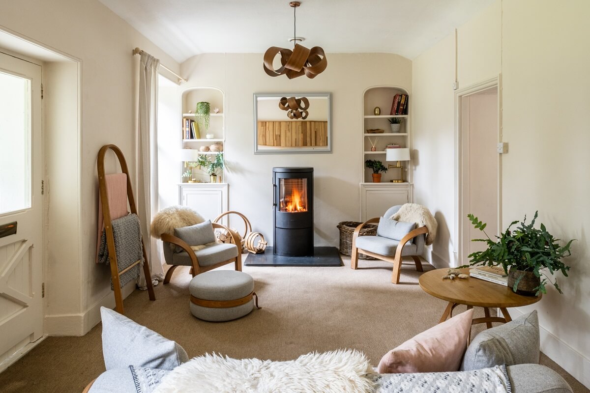 An English Country House That Pairs History with Contemporary Design 10 light-colored-sitting-room-wood-burner-built-in-shelves-nordroom