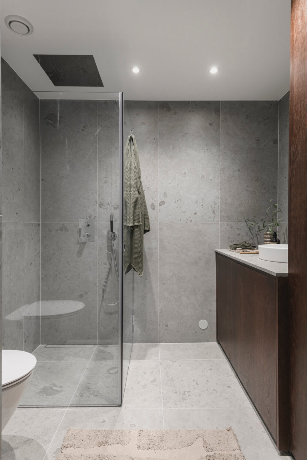 A Stylish Modern Gray Attic Apartment 20 modern-scandinavian-bedroom-gray-tiles-wooden-vanity-nordroom