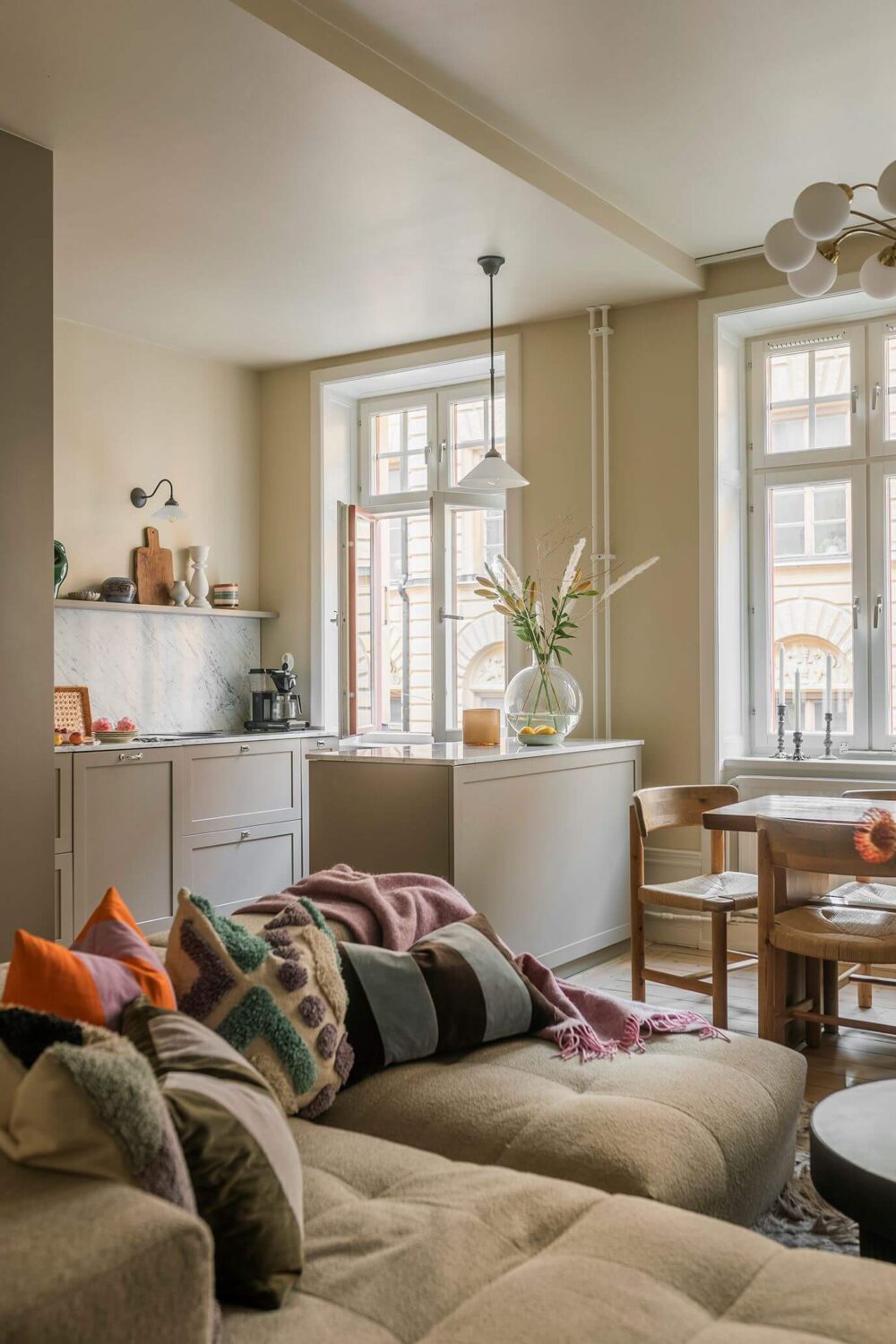 A Cozy Scandinavian Apartment with a Cobalt Color Accent 3 corner sofa with pillow scandinavian home