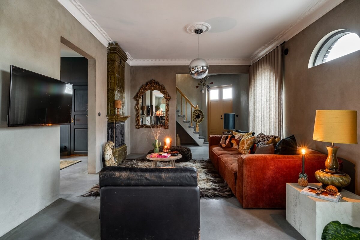 A Unique Bohemian Family Home in a Former Swedish Bakery 1 cozy-living-room-burnt-orange-sofa-nordroom