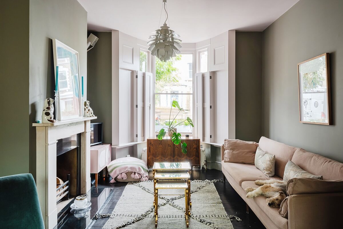 green-living-room-fireplace-pink-sofa-nordroom
