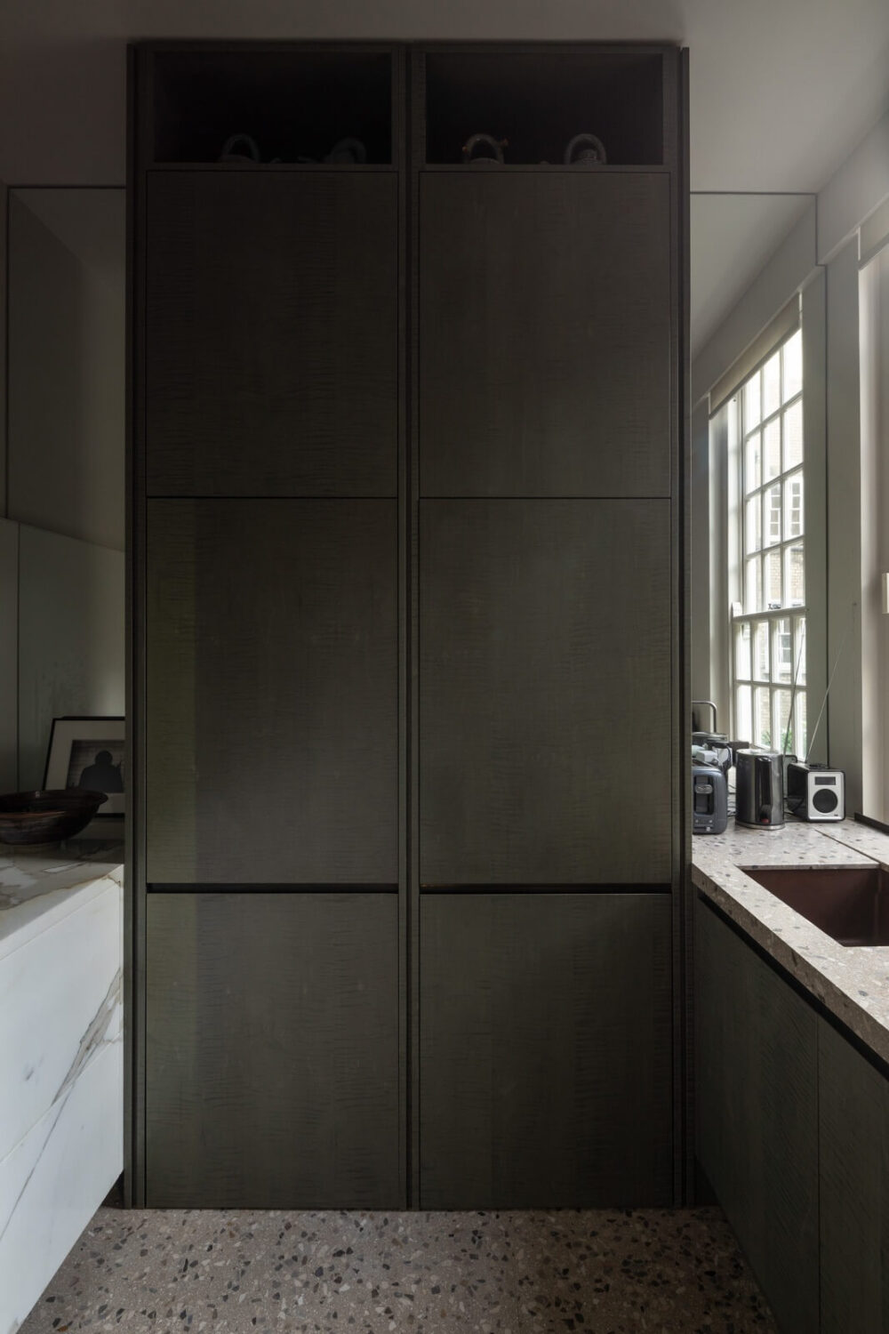 A Unique London Home with Terrazzo Tiles and a Roof Terrace 15 modern galley kitchen terrazzo floor tiles