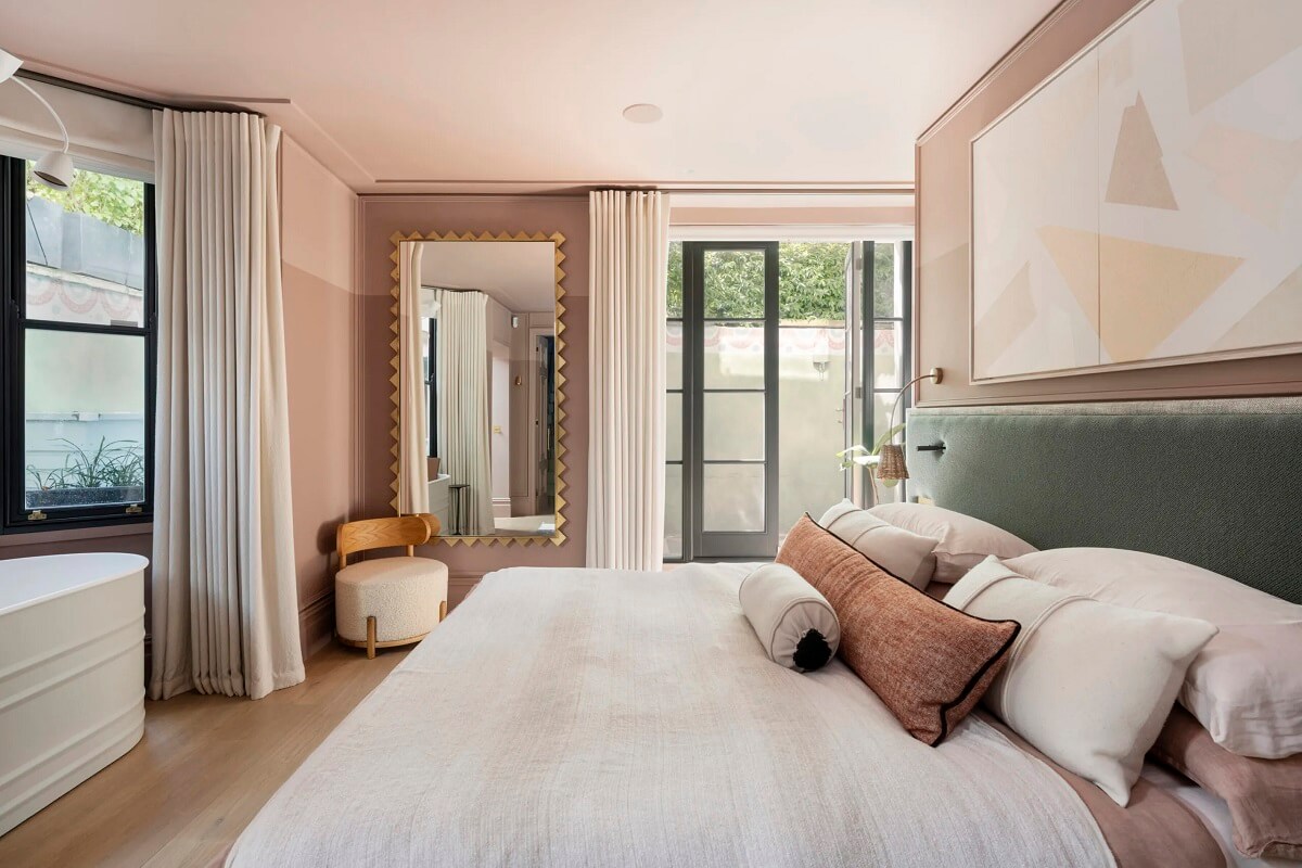 Best of 2023: Bedrooms 9 pink-master-bedroom-green-headboard-bath-tub-nordroom
