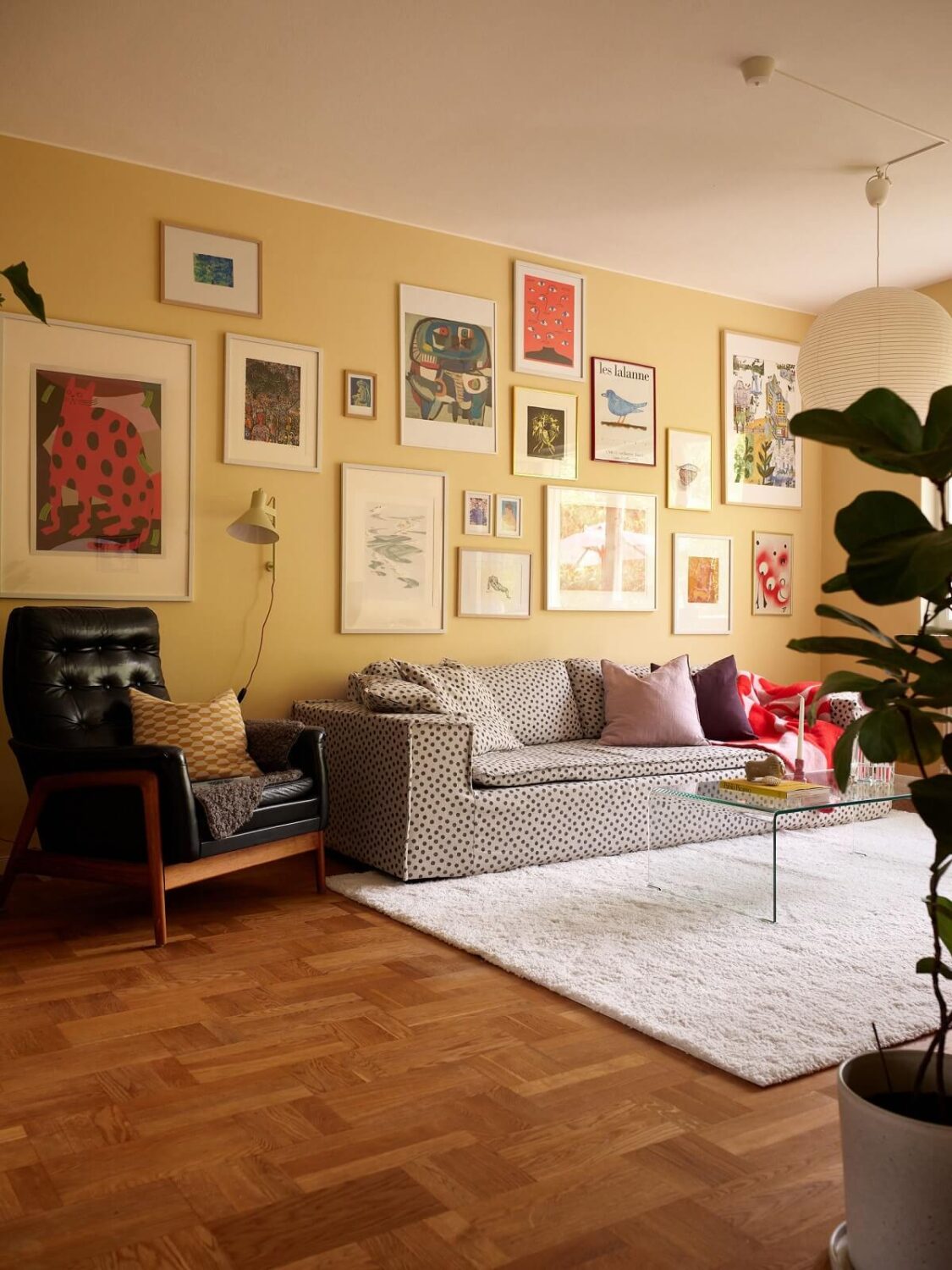 Soft Yellow Walls in a Swedish Apartment 4 yellow-walls-living-room-wooden-floor-polkadot-sofa-nordroom