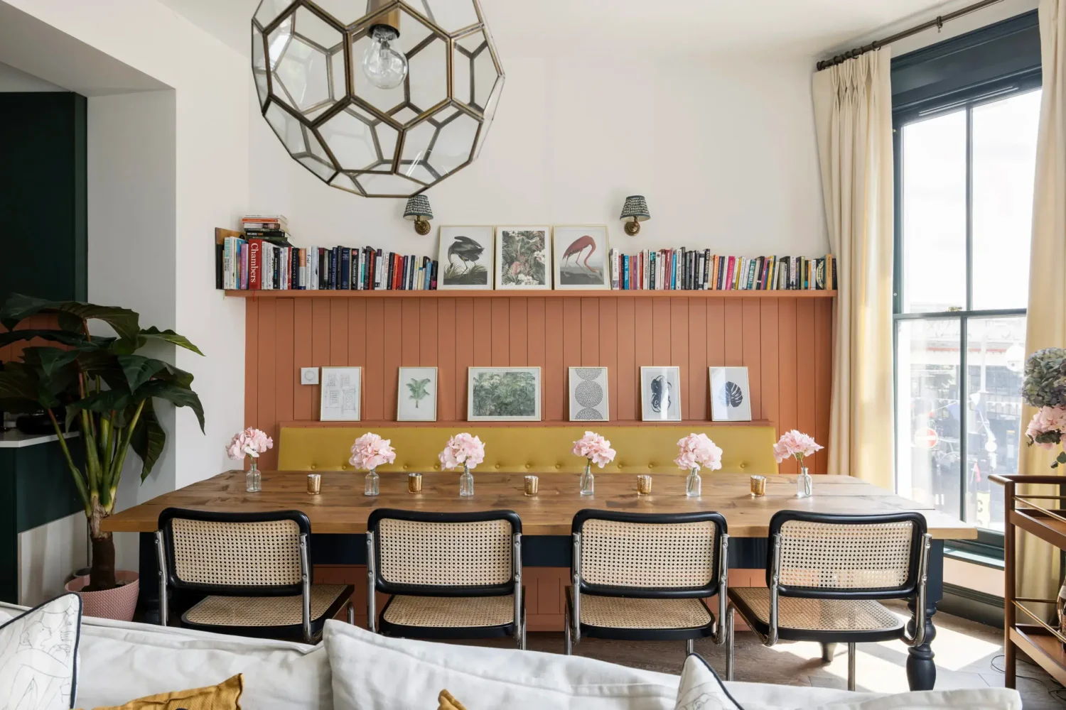 A London Maisonette with Color Pops 3 dining table with bench terracotta color accent