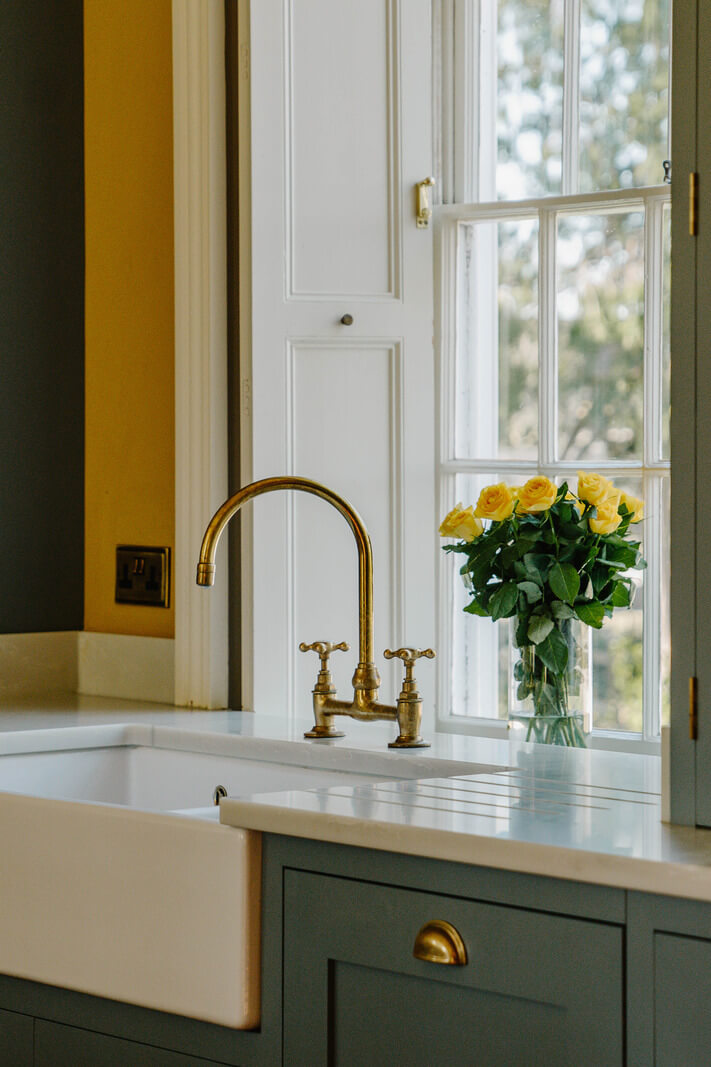 A Cozy Historic English Country House with Exposed Beams 4 butler sink brass fittings kitchen country house nordroom