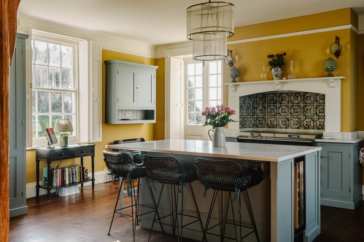 A Cozy Historic English Country House with Exposed Beams 2 kitchen island yellow walls historic english house nordroom