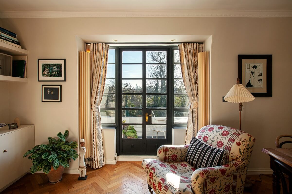 A Charming Apartment in an Art Deco Building in London 1 living-room-floral-armchair-nordroom