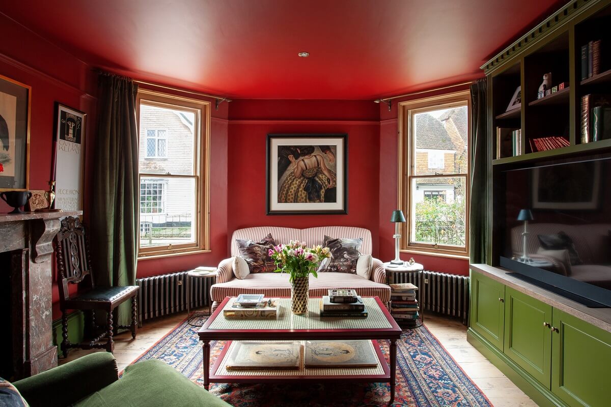 Bold Colors in a Charming Historic House in England 1 red-living-room-green-built-in-cabinets-nordroom