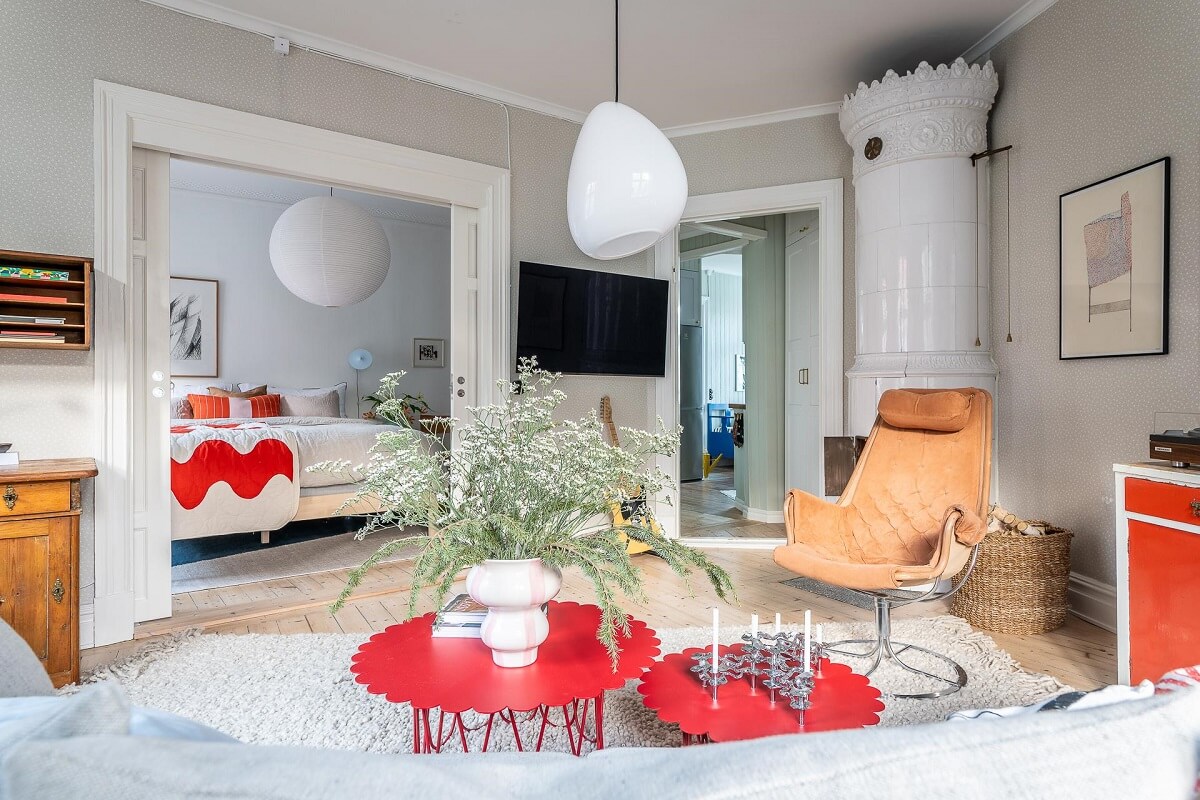 Primary Color Accents in a Light Swedish Apartment 9 scandi-living-room-fireplace-nordroom