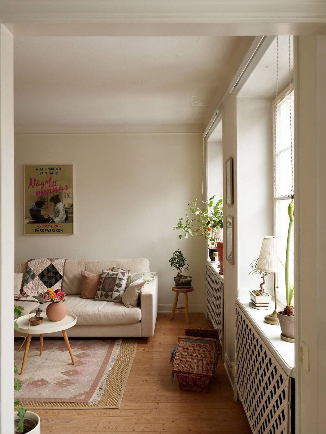 A Charming Swedish Apartment with a Cottage-Style Kitchen 2 scandinavian living room wooden floor