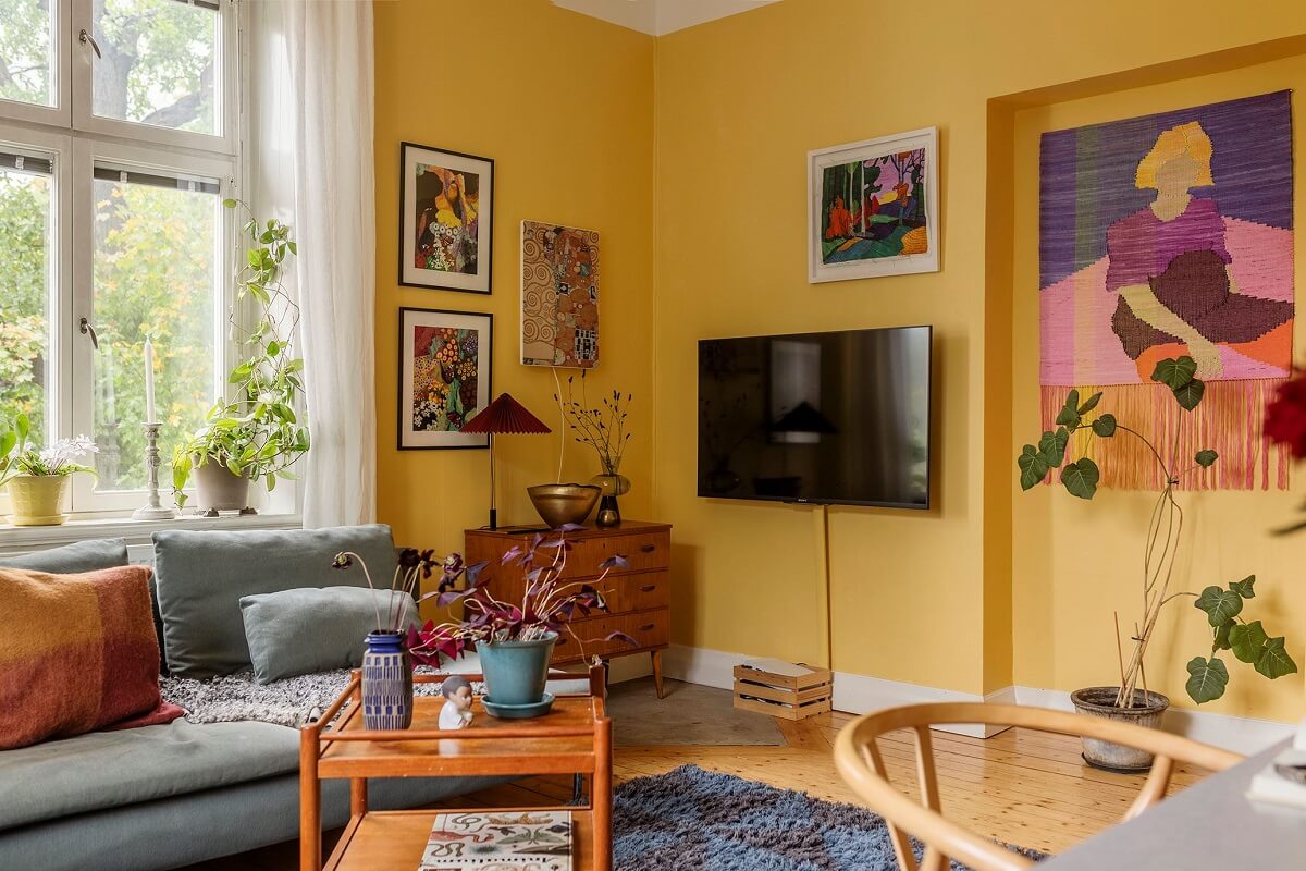 Best of 2024: Living Rooms 31 scandinavian living room yellow walls blue ikea sofa nordroom