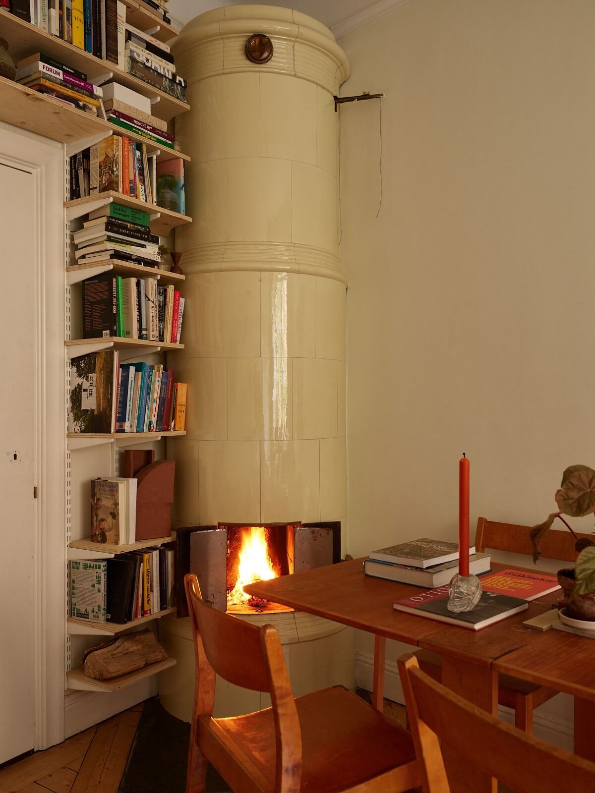 living room with fireplace and bookshelves