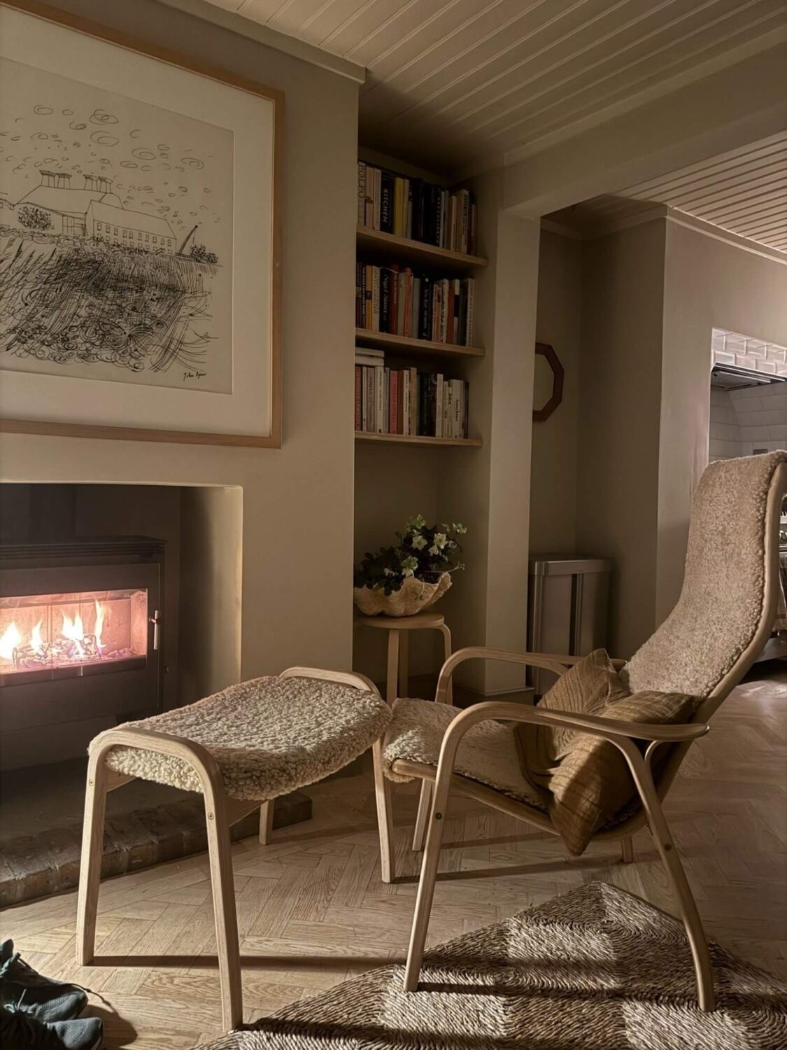 A Cozy and Charming Georgian Townhouse in London 11 lounge chair in front of the fireplace