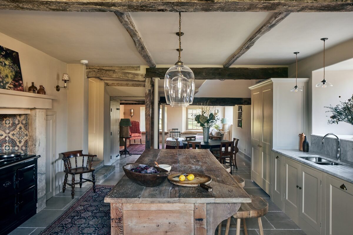 A Historic English Country House with Restored Interiors 1 rustic wooden prep table country house kitchen nordroom