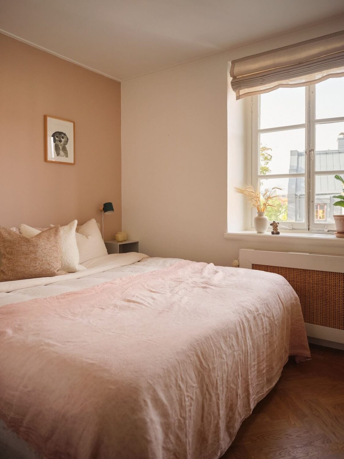 A Light Corner Apartment with a Pink Bedroom 16 bedroom with light pink accent wall