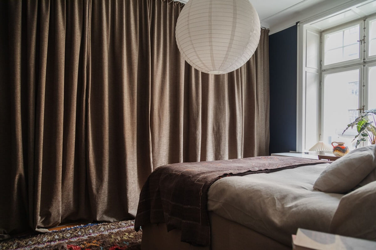 Moody Rooms in a Grand Stockholm Apartment 18 dark blue bedroom with wardrobes behind curtain