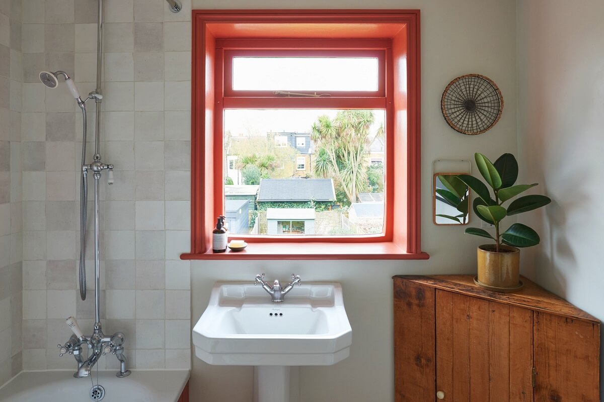 A Small Cottage-Style Apartment in London 12 little green tuscan red window trims