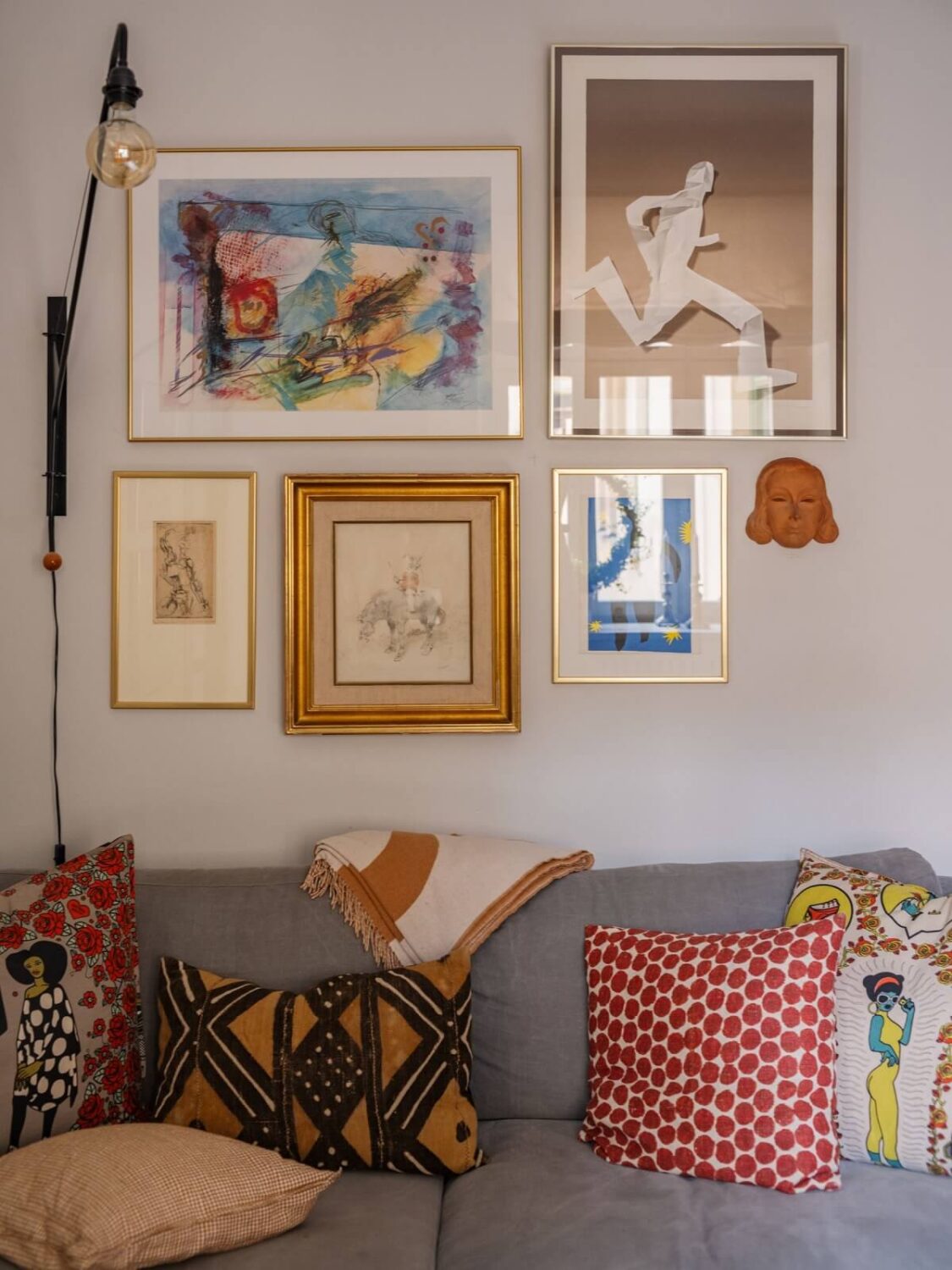 A Muted Color Palette in a Scandinavian Apartment 3 living room art detail