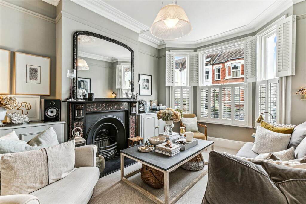 living room with fireplace and light gray walls