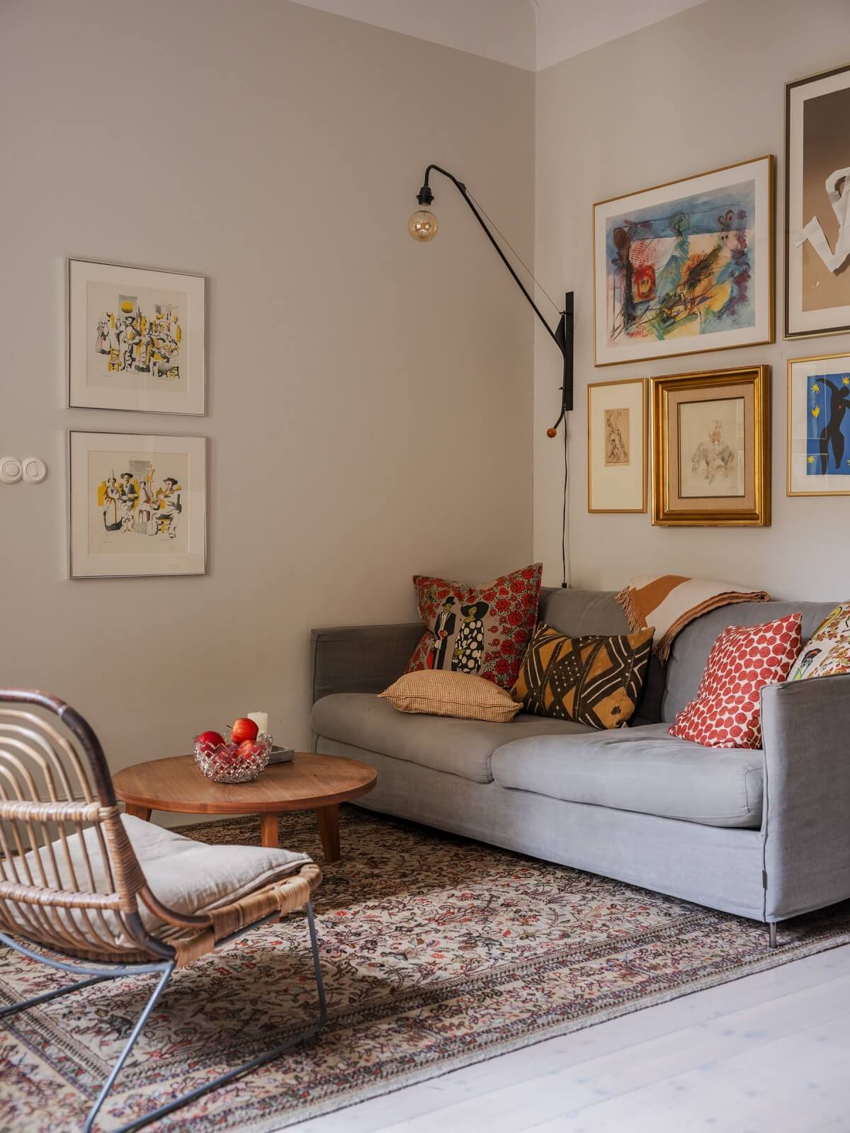 living room with light gray sofa art and beige walls