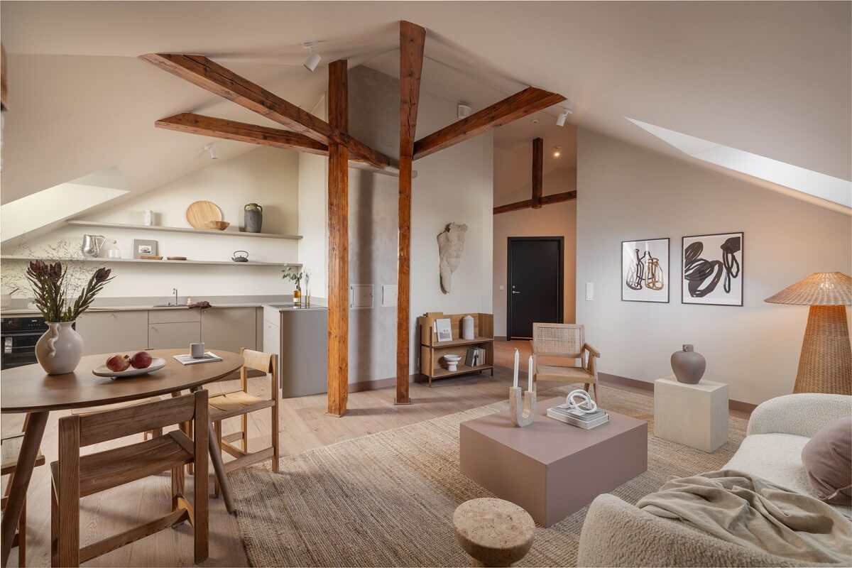 An Attic Apartment in Oslo with Exposed Wooden Beams 1 open plan living room and kitchen with wooden beams
