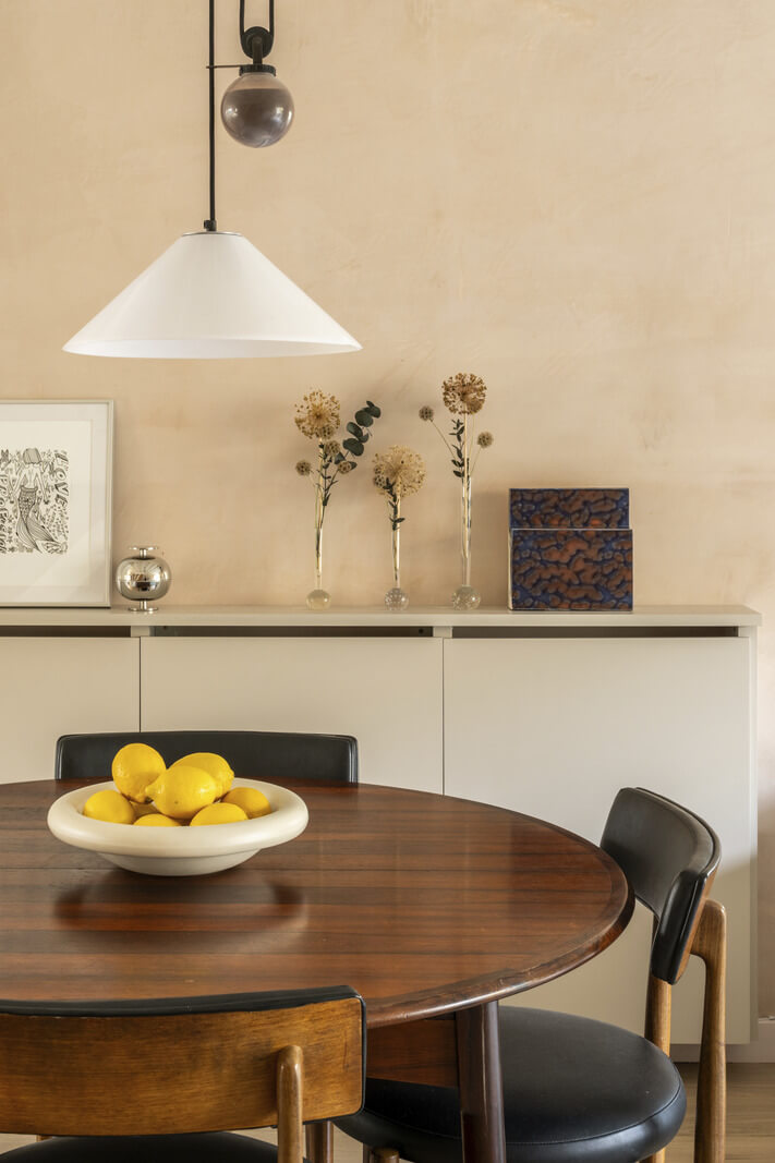 A Modern London Home with Plaster Walls 5 round wooden dining table