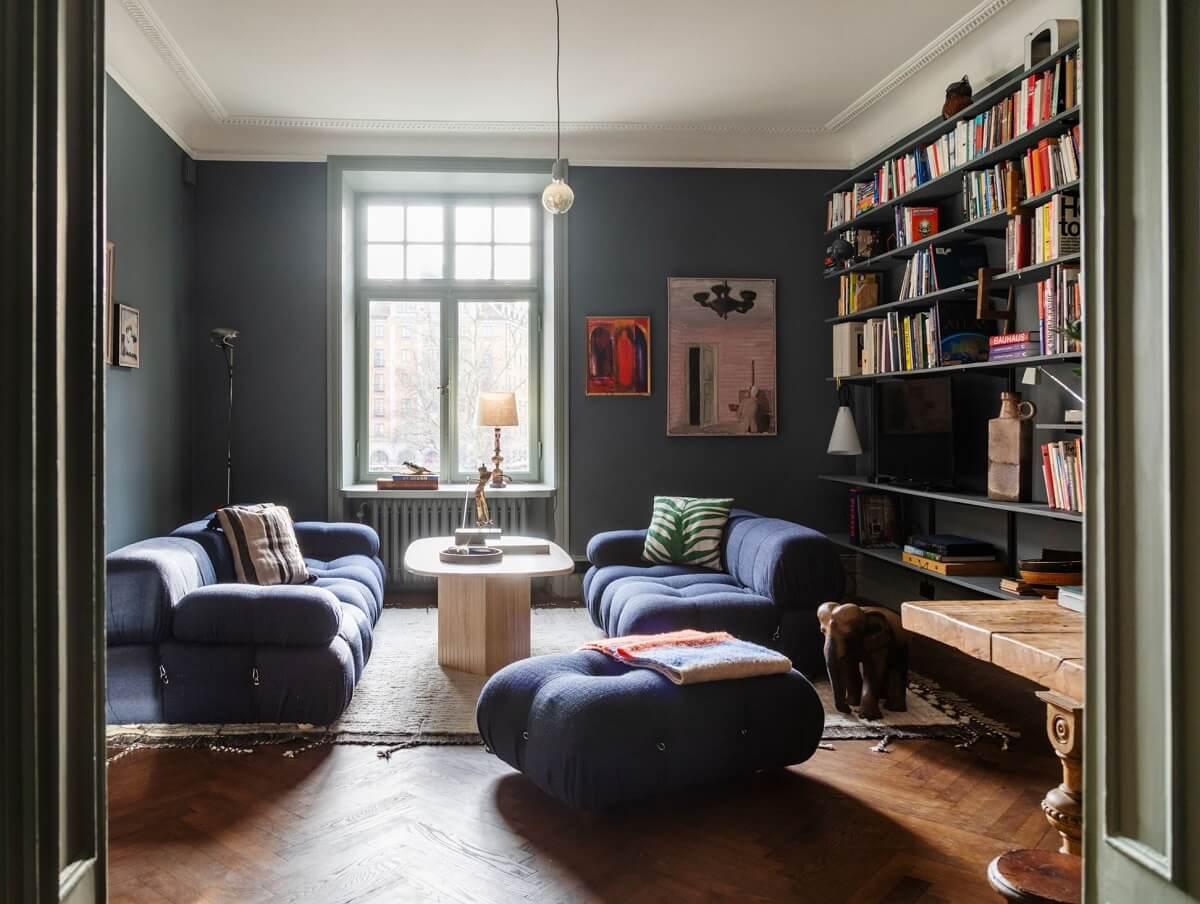 Moody Rooms in a Grand Stockholm Apartment 1 sitting room with bookshelves