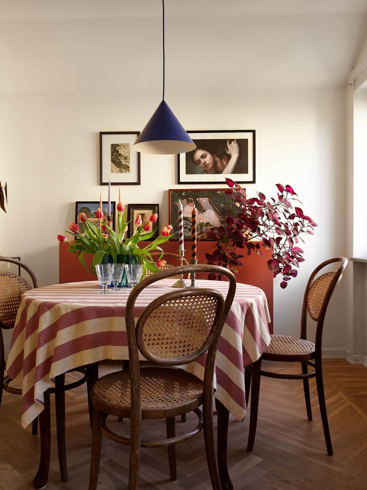 striped tablecloth and red cabinet