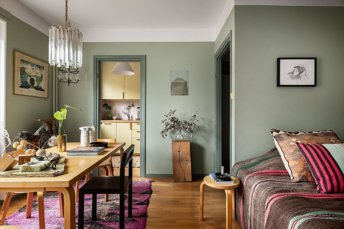 A Cozy Studio Apartment with a Yellow Kitchen 10 studio apartment with large table