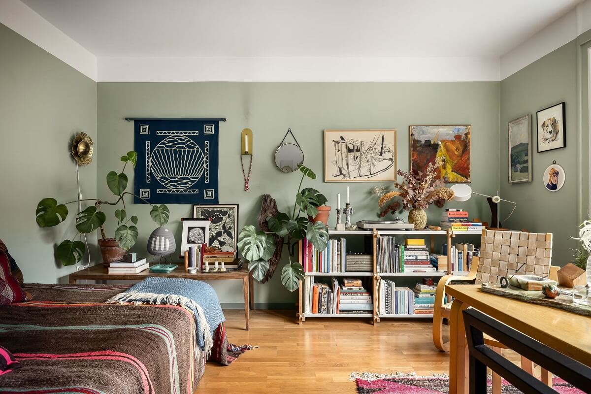 A Cozy Studio Apartment with a Yellow Kitchen 1 studio apartment with plants