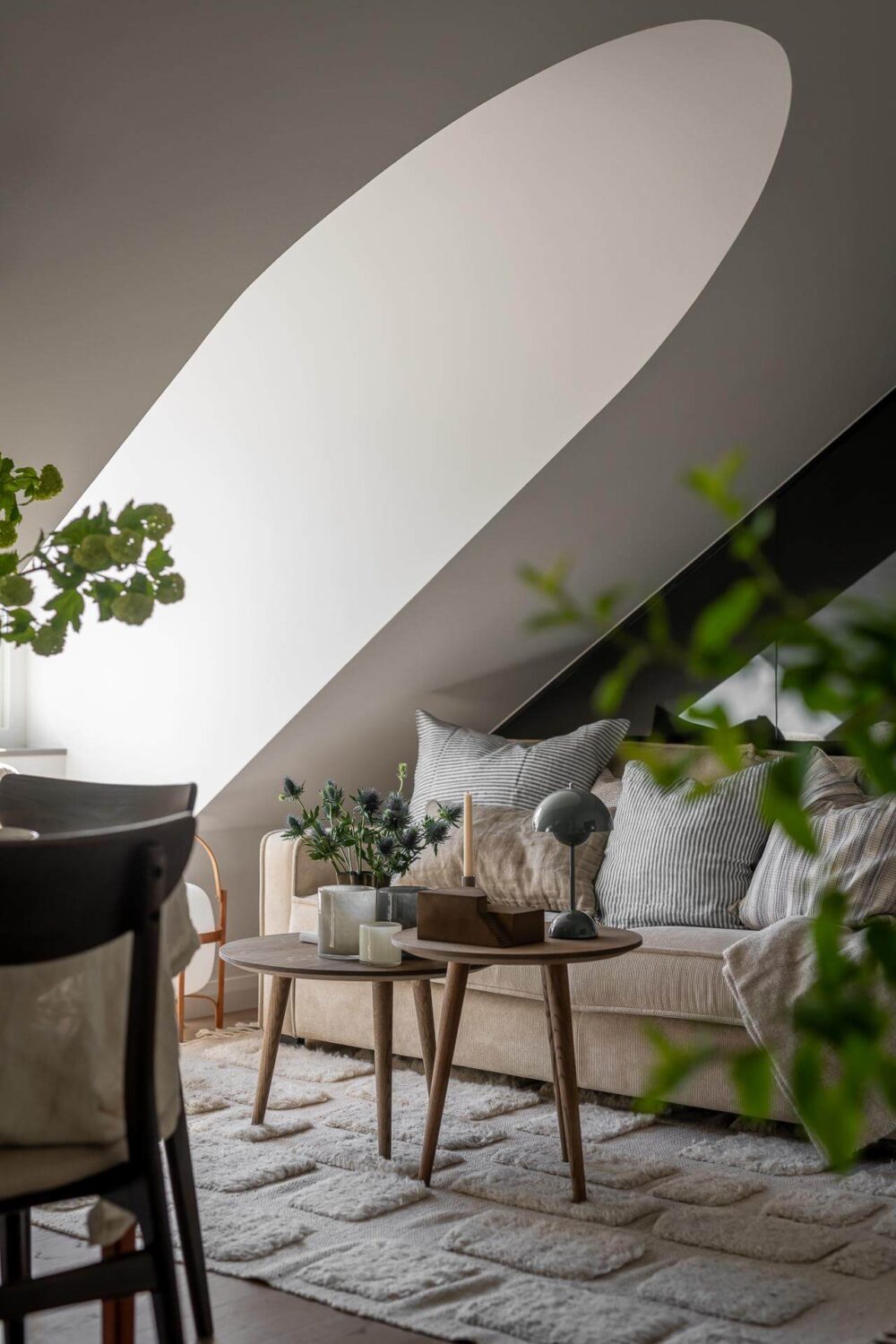 An Attic Studio Apartment with a Glass Room Divider 3 attic studio sitting area