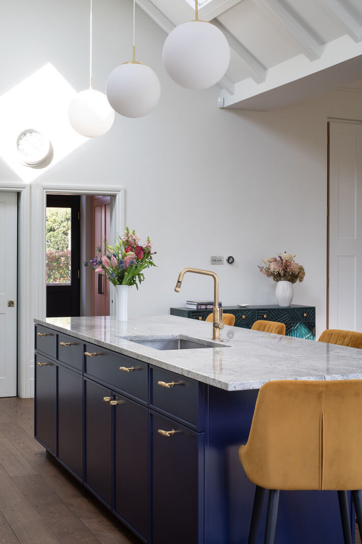 A Colorful London Family Home Renovated by Fraher & Finlay 11 dark blue kitchen island