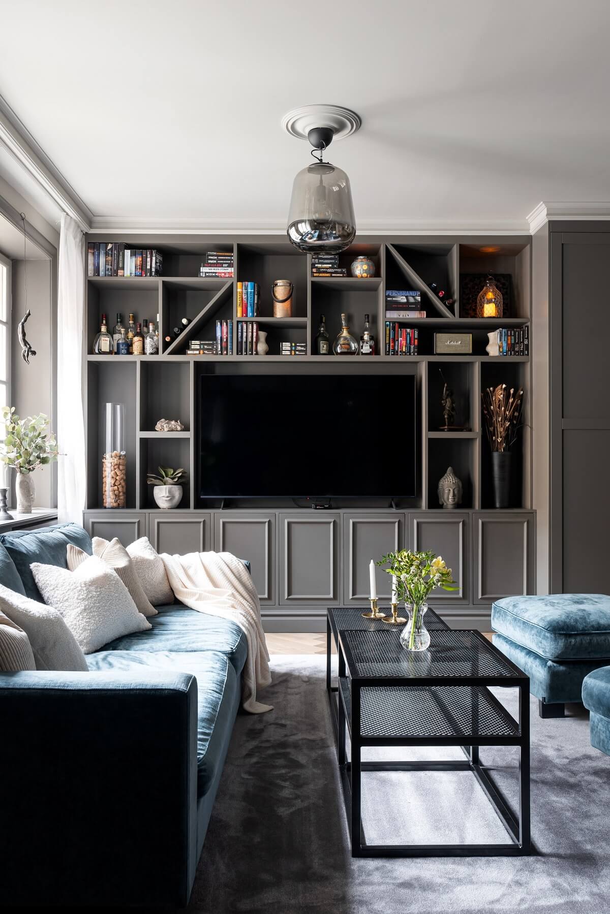 gray living room with custom storage system