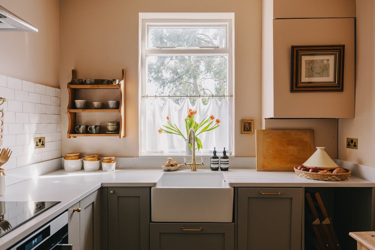 A Small London Apartment Filled with Books 9 kitchen butler sink setting plaster farrow and ball nordroom