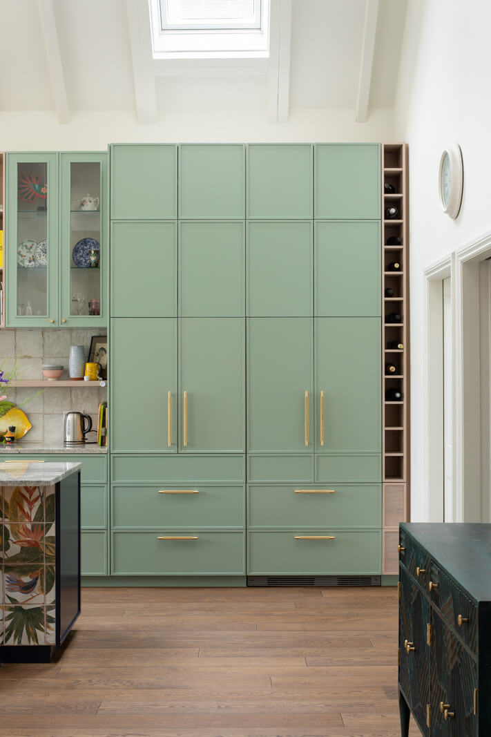 A Colorful London Family Home Renovated by Fraher & Finlay 8 light green kitchen cabinets