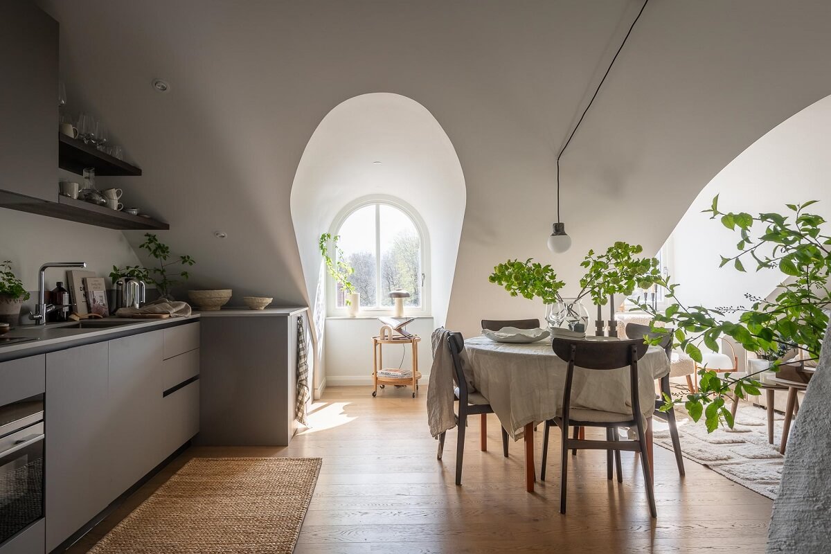 An Attic Studio Apartment with a Glass Room Divider 12 studio apartment kitchen dining space
