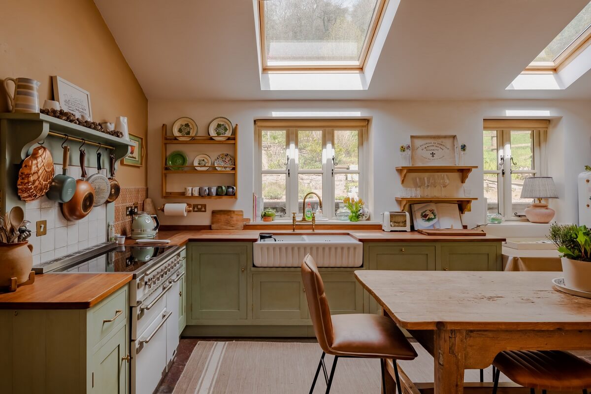 The Pros and Cons of a Wooden Kitchen Countertop 2 cottage kitchen with butler sink under window and farmhouse table nordroom