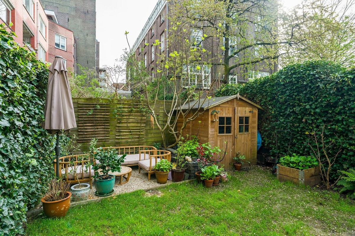 A Colorful Family Home with Open-Plan Spaces in Amsterdam 23 garden with lawn and terrace