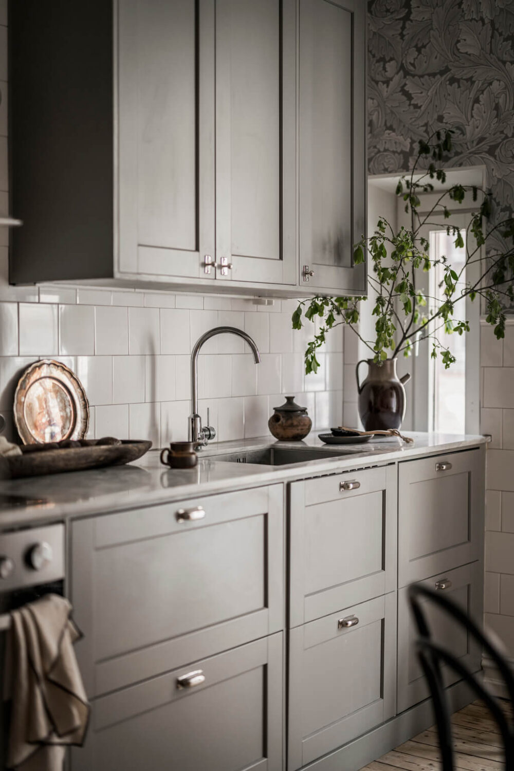 Wallpaper and Historic Charm in a Swedish Apartment 14 gray kitchen cabinets