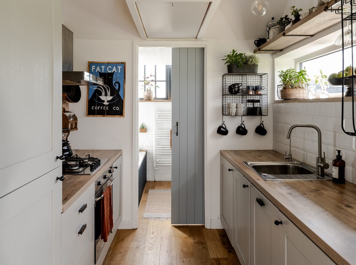 A Tiny Off-Grid House in the English Countryside 6 kitchen-with-sliding-door-to-bathroom-nordroom