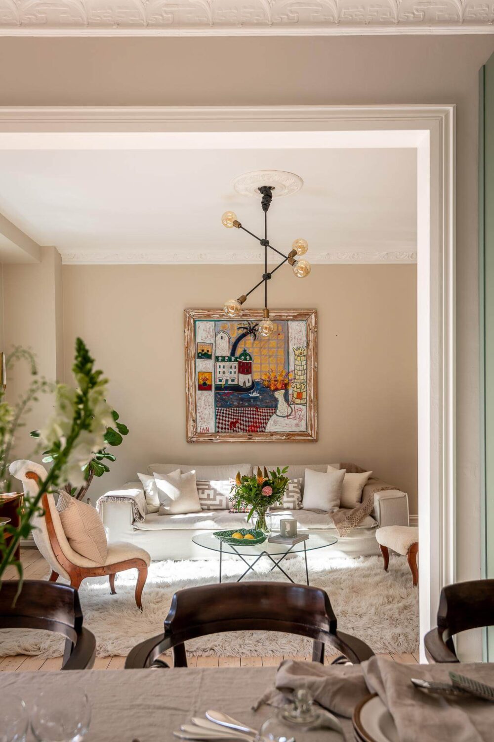 A Turn of the Century Apartment with a Green Kitchen 1 light scandi living room