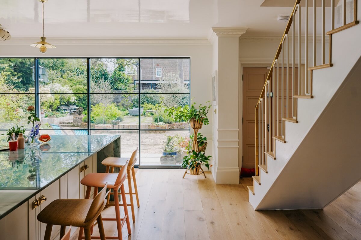 A White English House with a Beautiful Open-Plan Kitchen 5 open plan ktichen with bar seating