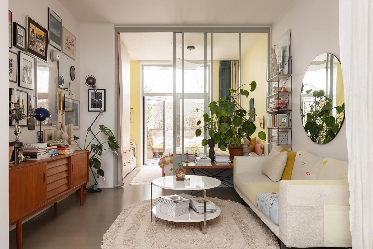 A Unique Basement Apartment in Stockholm 1 scandi living room with glass wall to bedroom